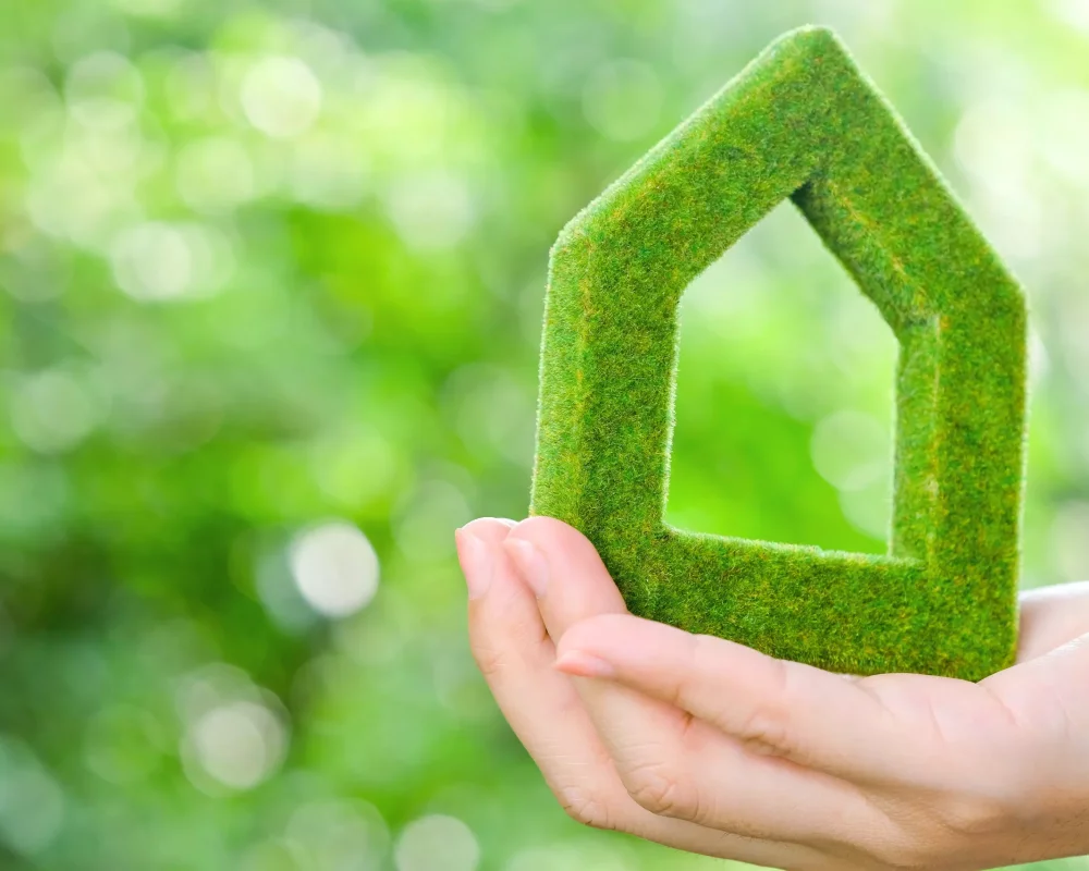 close-up-hand-holding-model-house
